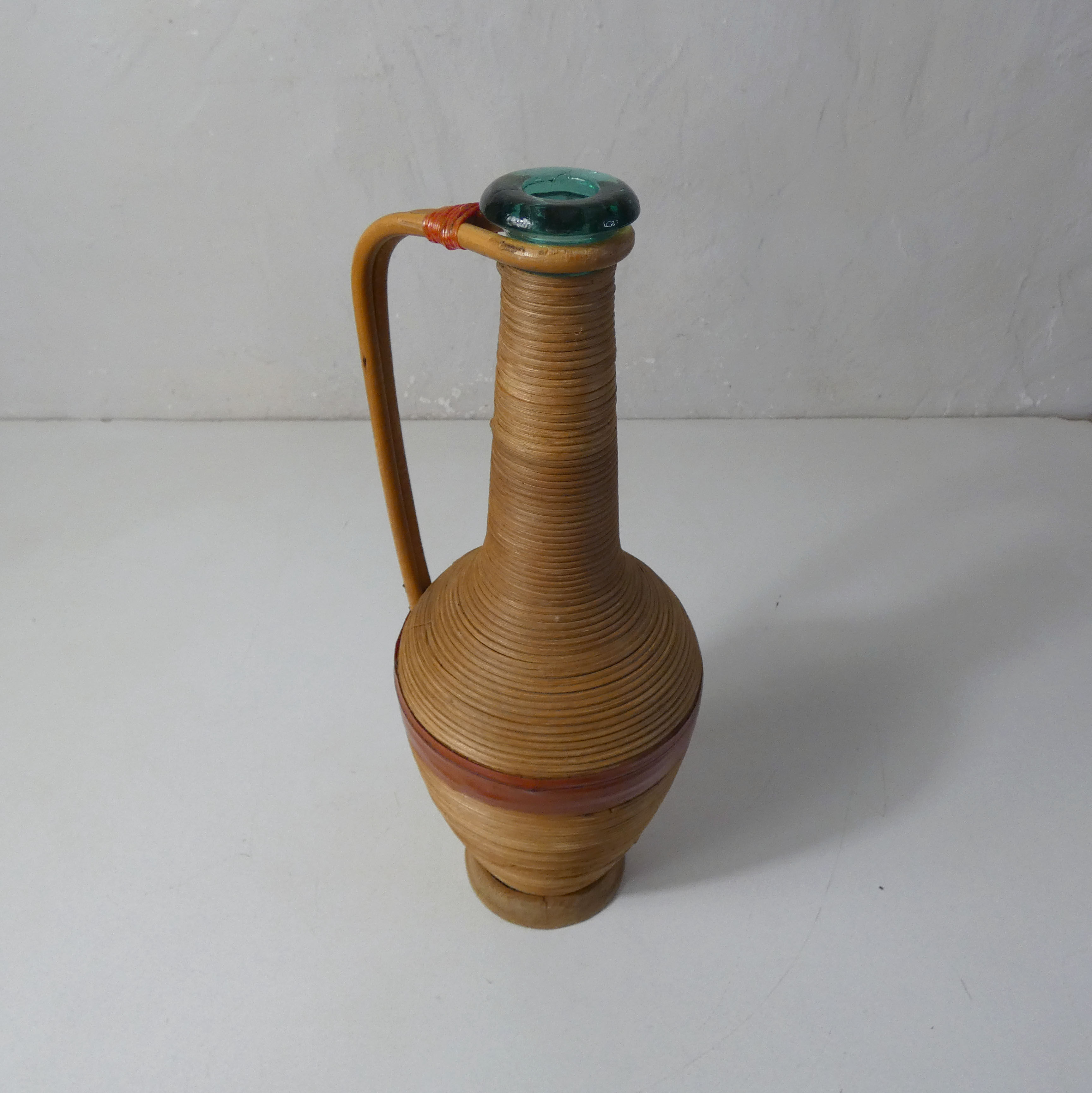 Old bottle dressed in vintage wood rattan