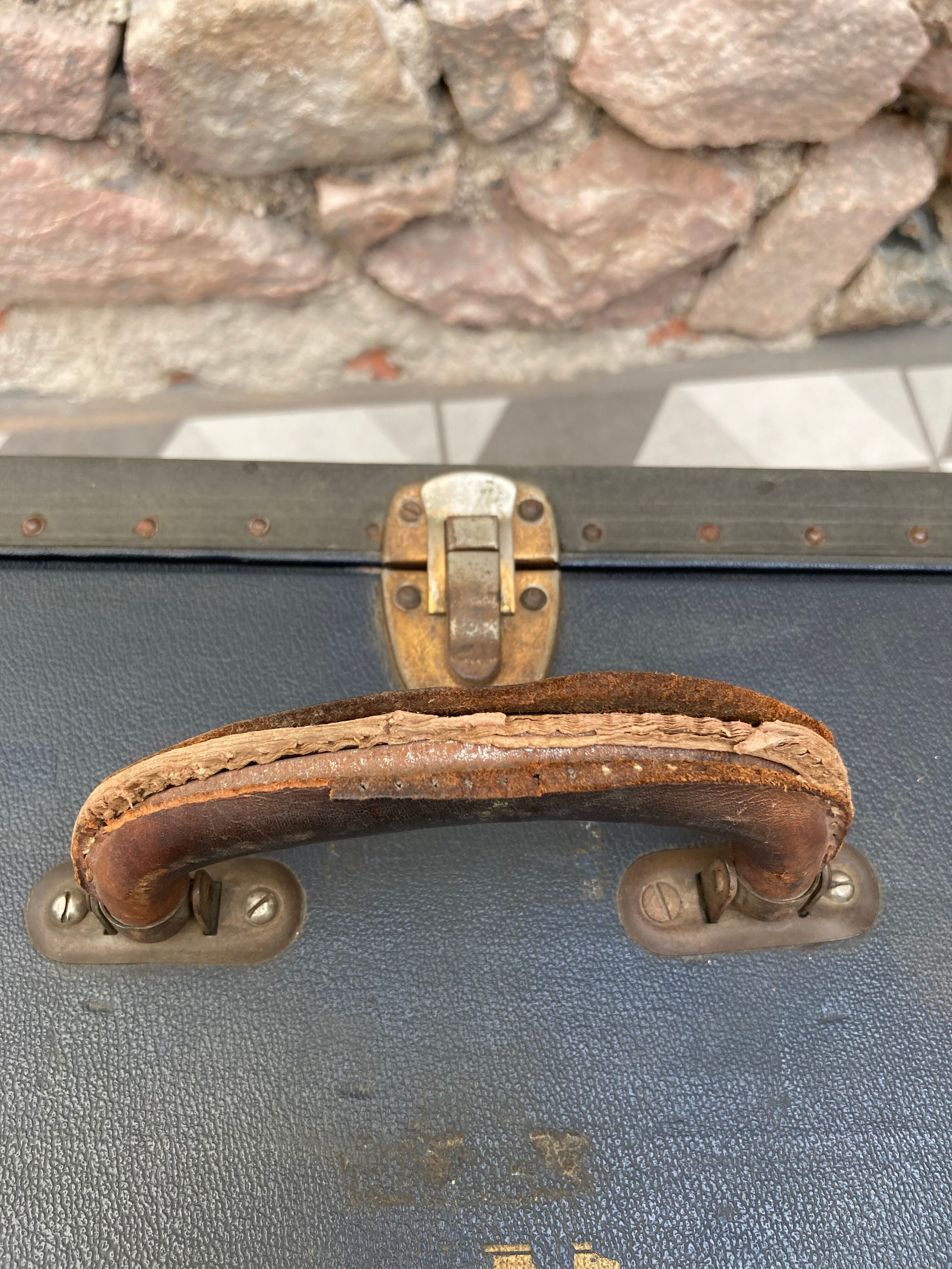 Midnight blue suitcase of representative 30s