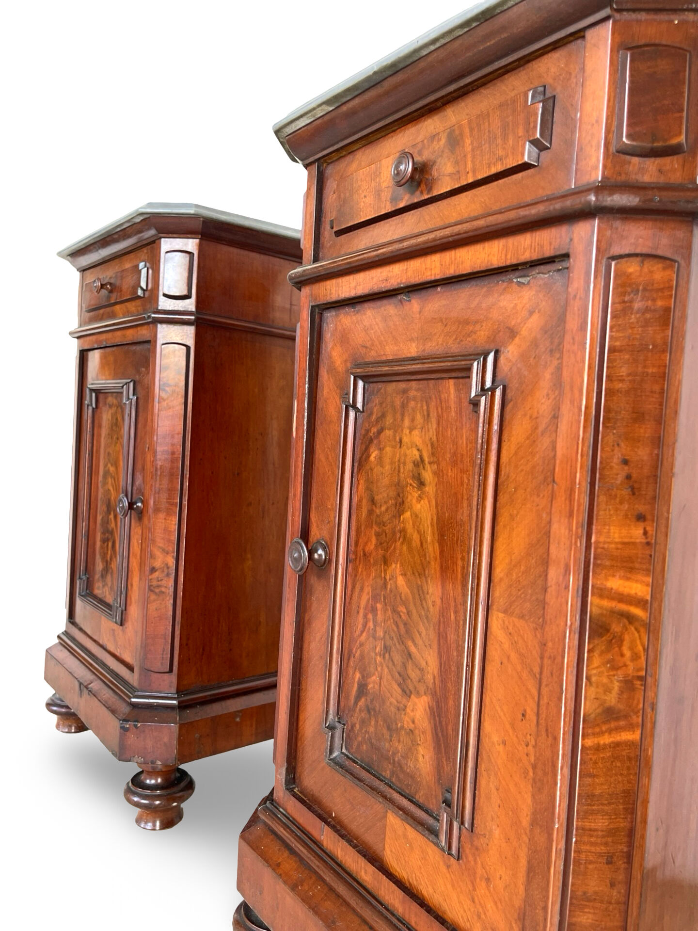A pair of antique walnut bedside tables from the 1890s.