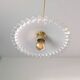 Vintage suspension in lace opaline, elegant light fixture with soft light.