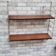 Shelf 1950 has 70 gold uprights and and plating shelf with black plastic border,