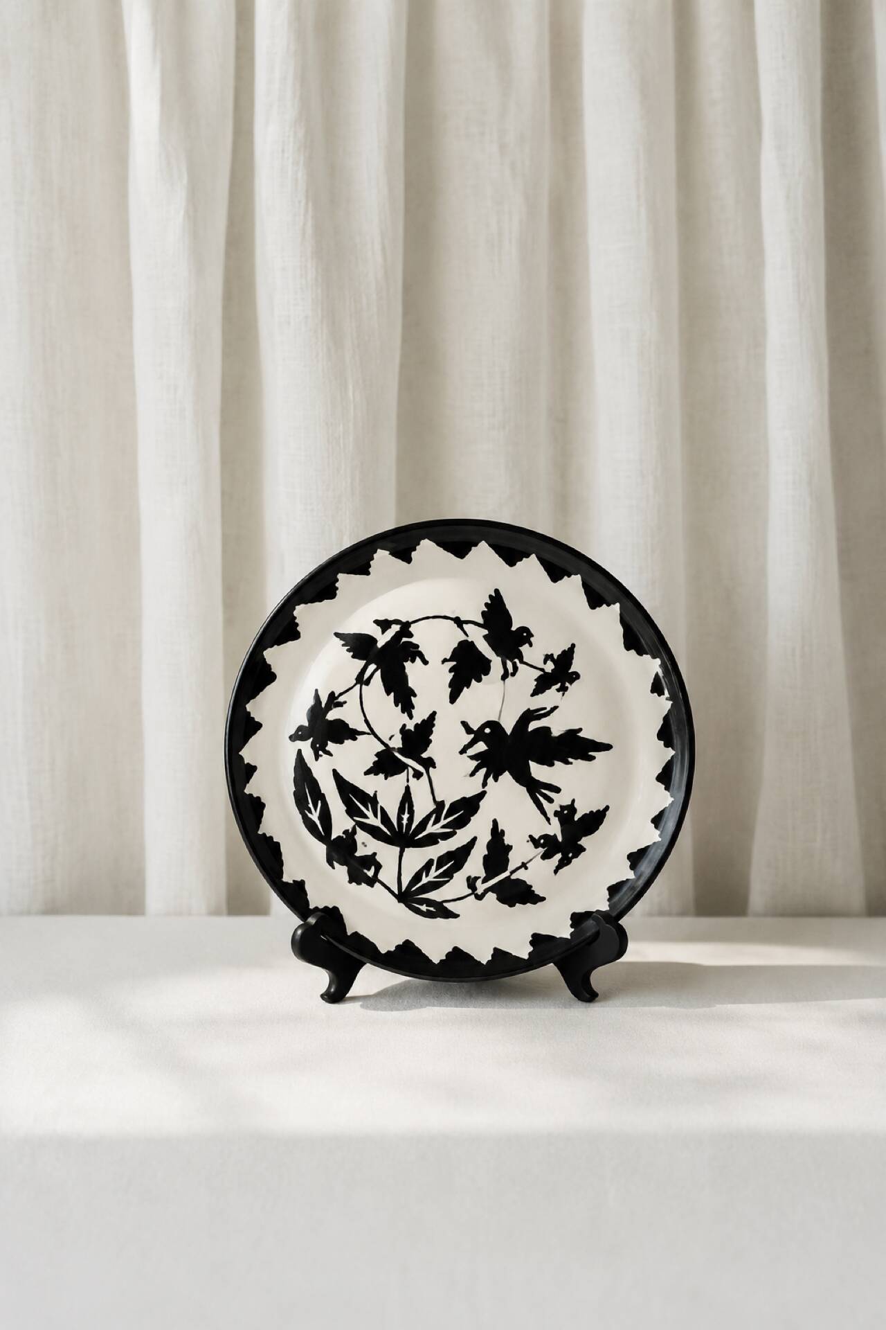Large ceramic plate J. Lurçat with zoomorphic decoration in black on a white background.