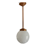 Opaline white globe pendant light with metal stem, Art Deco style.