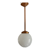 Opaline white globe pendant light with metal stem, Art Deco style.
