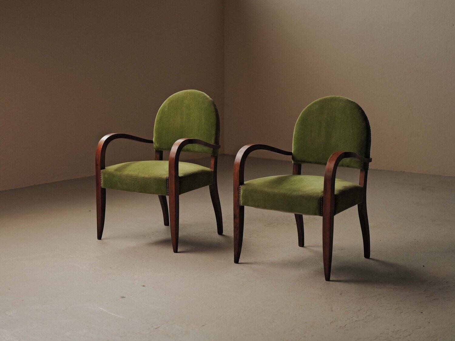 Pair of Art Deco armchairs in mahogany, circa 1930.