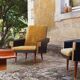 Pair of vintage 60s armchairs in black imitation leather and mustard toffee