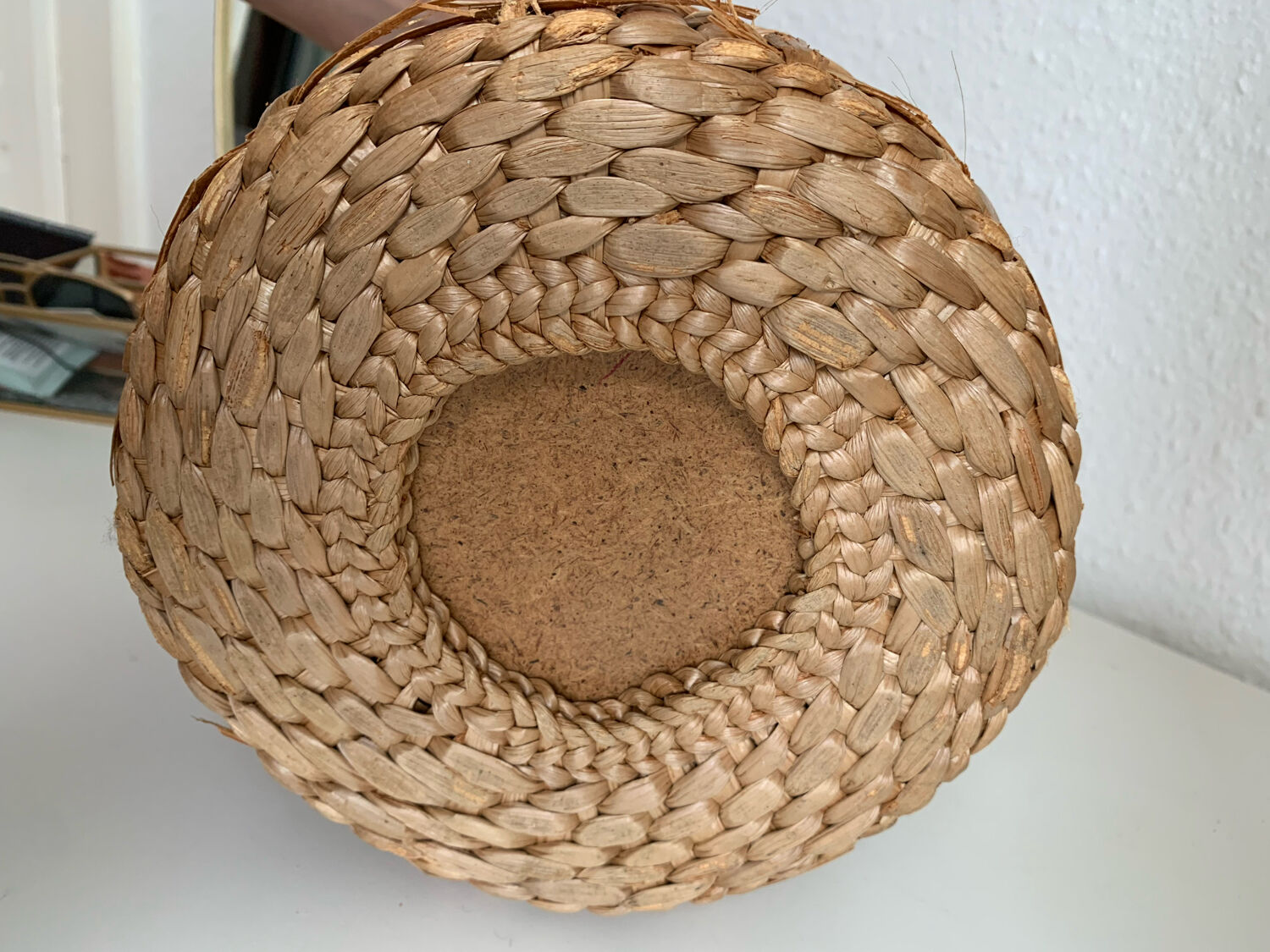 Green glass jar with wickerwork