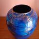 Blue and gold ceramic vase