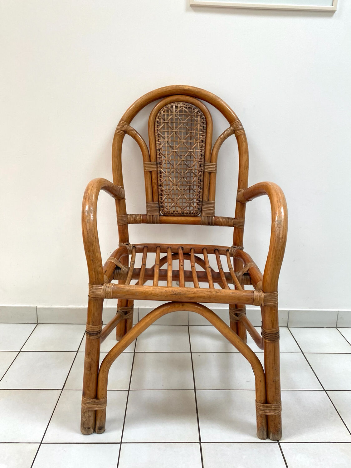 Vintage rattan and bamboo armchair from the 1970s.