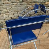 Quartet of blue chairs with design curves