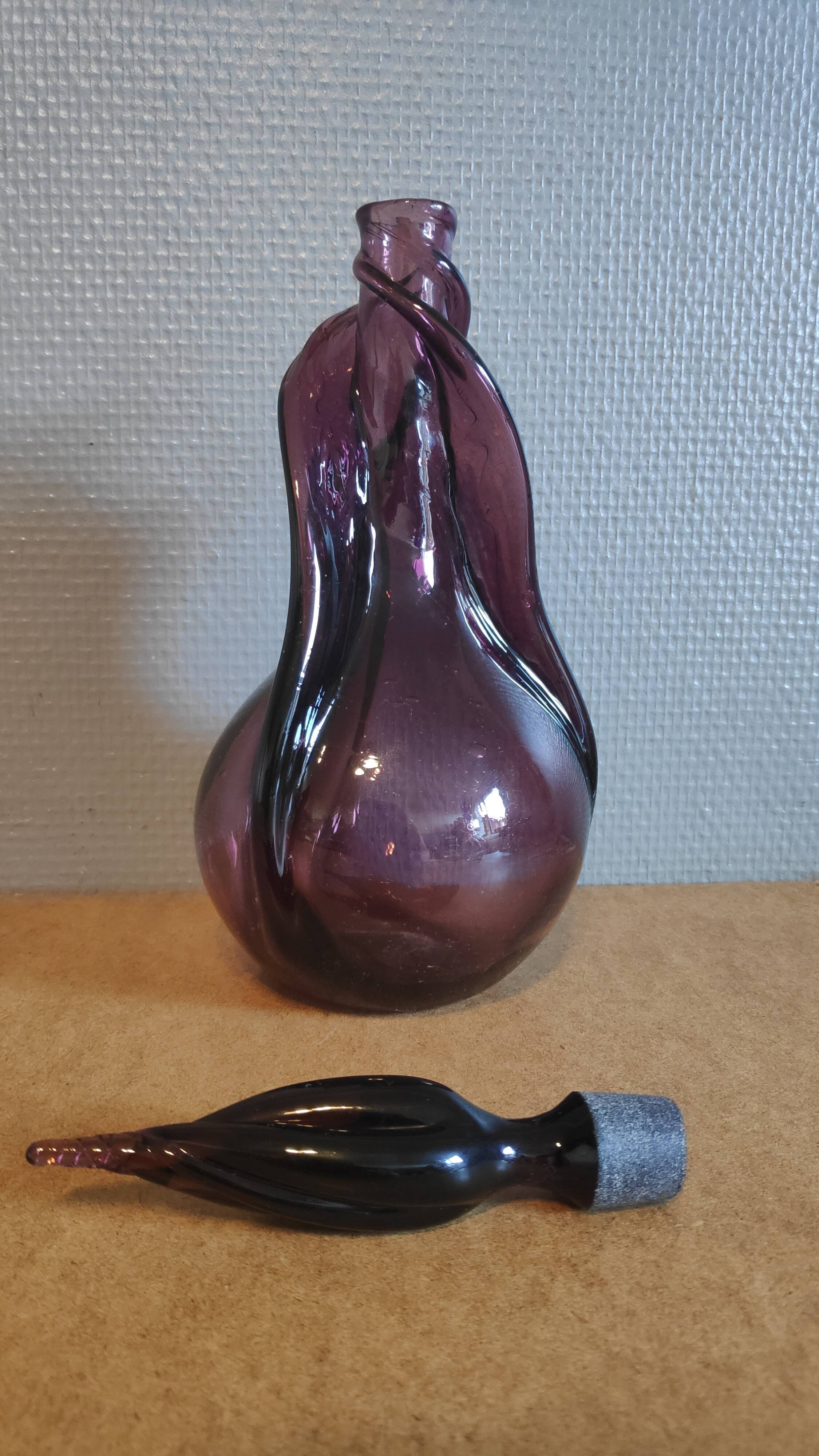 Purple decanter made of blown glass