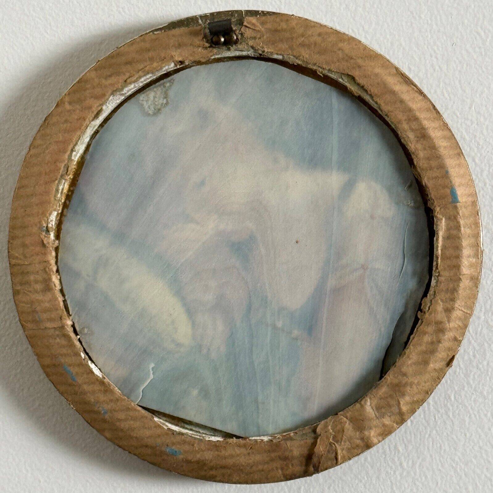 19th century miniature of a young girl with her head resting on a cushion