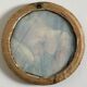 19th century miniature of a young girl with her head resting on a cushion