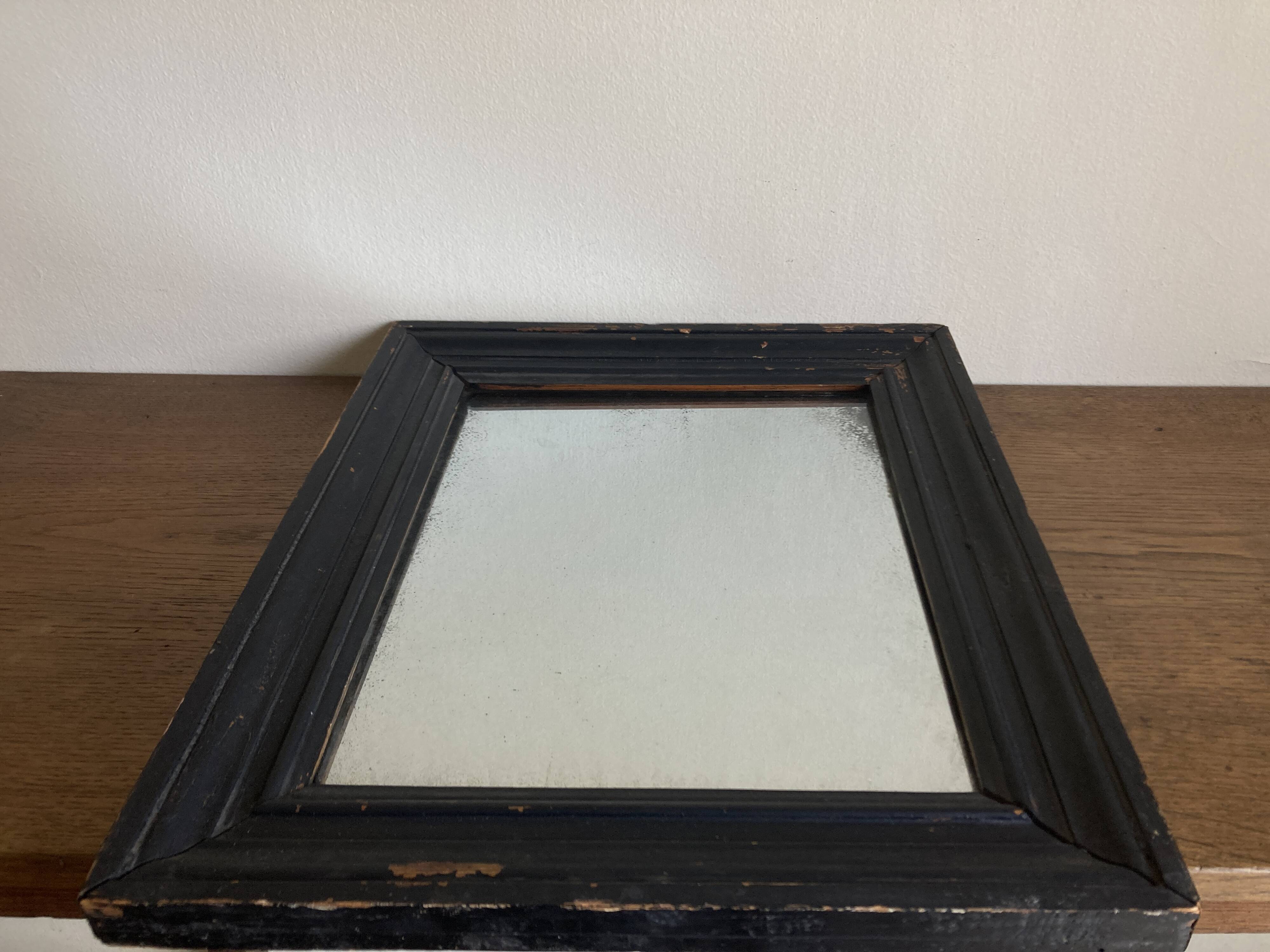 19th century blackened mirror with pitted glass 34cm x 40cm