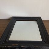 19th century blackened mirror with pitted glass 34cm x 40cm