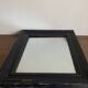 19th century blackened mirror with pitted glass 34cm x 40cm