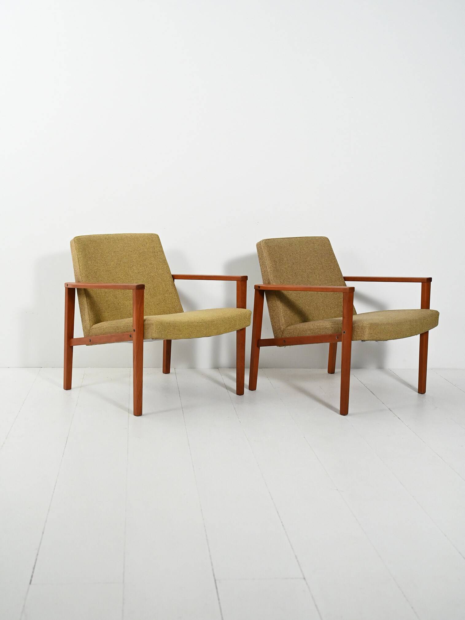 Pair of Danish teak armchairs with green upholstery