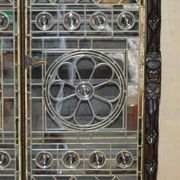 Jacobean hardwood library with carved panels and glass doors.