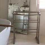 Old bathroom towel rack in patinated wood