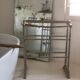 Old bathroom towel rack in patinated wood