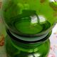 Green glass apothecary flask and golden edars old pot