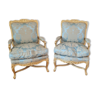 Pair of Louis XV style gilded wooden armchairs