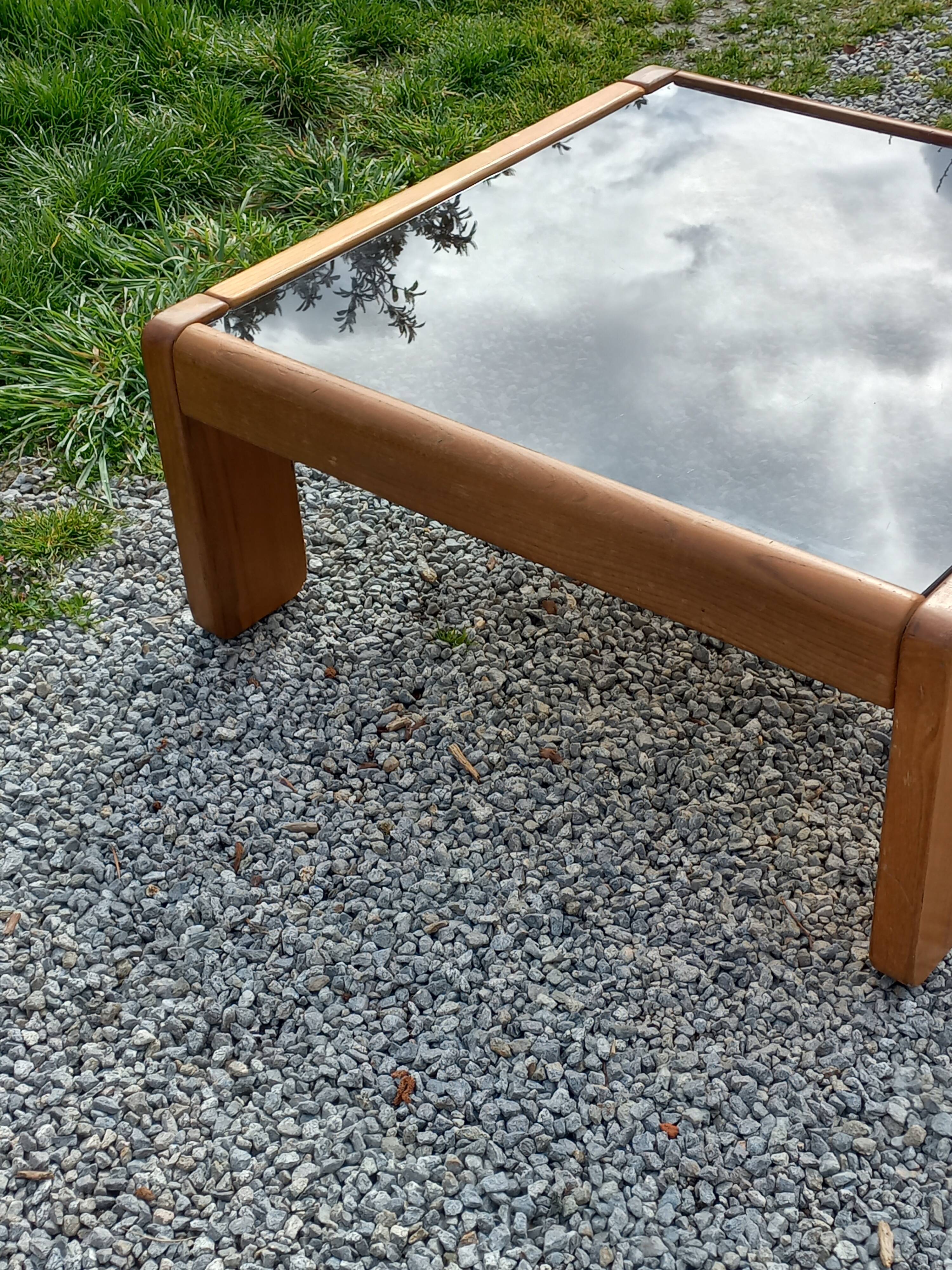 Coffee table from Regain in solid elm with a smoked glass top.