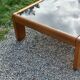 Coffee table from Regain in solid elm with a smoked glass top.