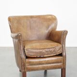 Nice, subtle cowhide armchair with a reversible kilim seat cushion
