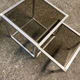 Set of coffee tables, pedestal tables and nesting tables in smoked glass and metal