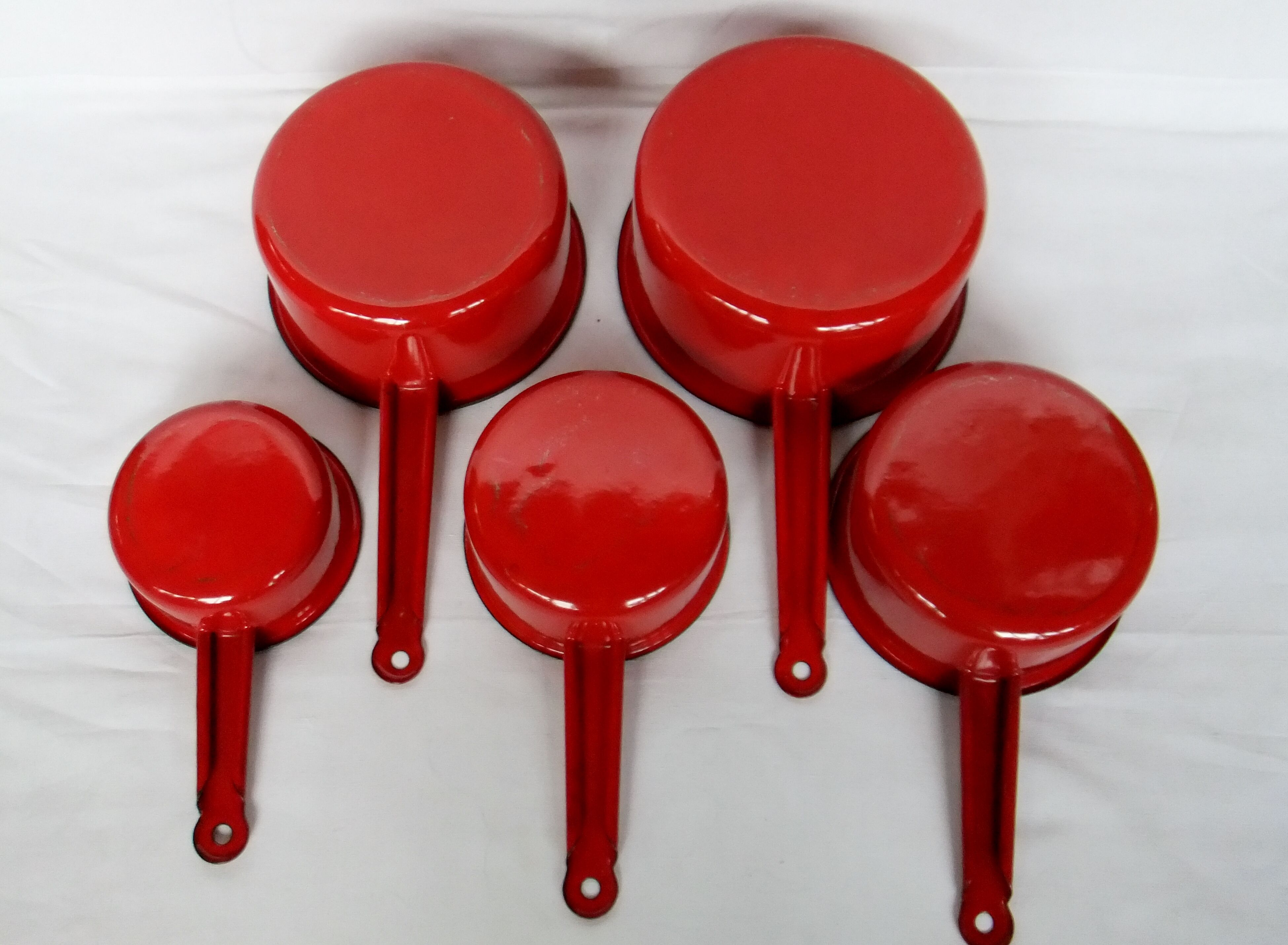 Red enamelled sheet metal pans