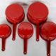 Red enamelled sheet metal pans