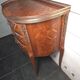 Small curved chest of drawers in Louis XV style with marquetry.
