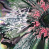 Green faience bowl decorated with multicolored drips around 1970