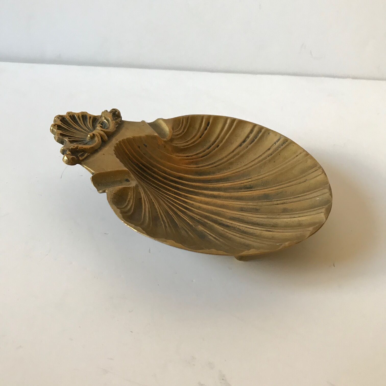 Empty pocket brass ashtray