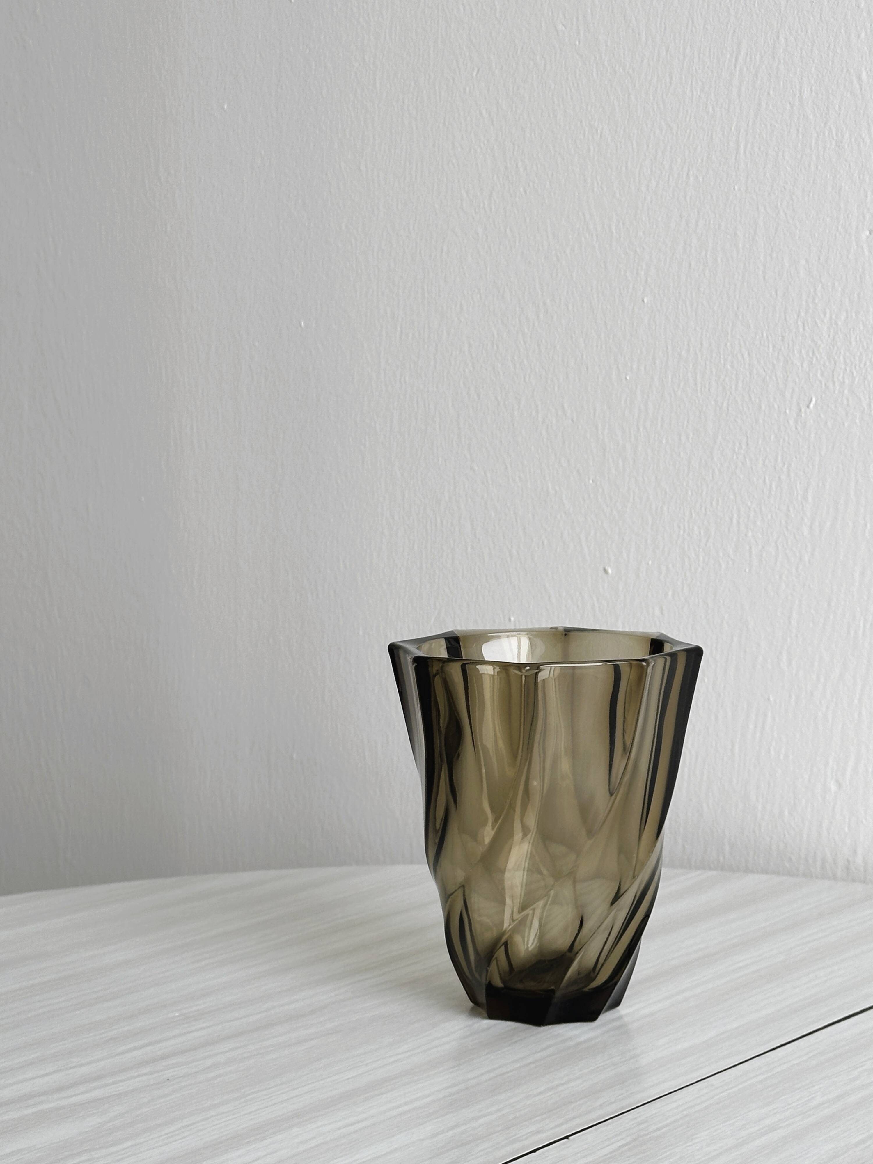 Smoked glass vase with twisted design