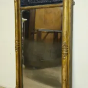 Large antique gilded wooden mirror with terracotta relief from the Empire period.