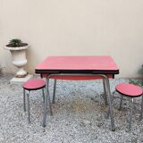 Table with two stools in red formica
