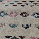 White margoum carpet with multicolored Berber patterns