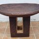 African monoxyle side table in carved wood with a curved top, 48x36 cm.