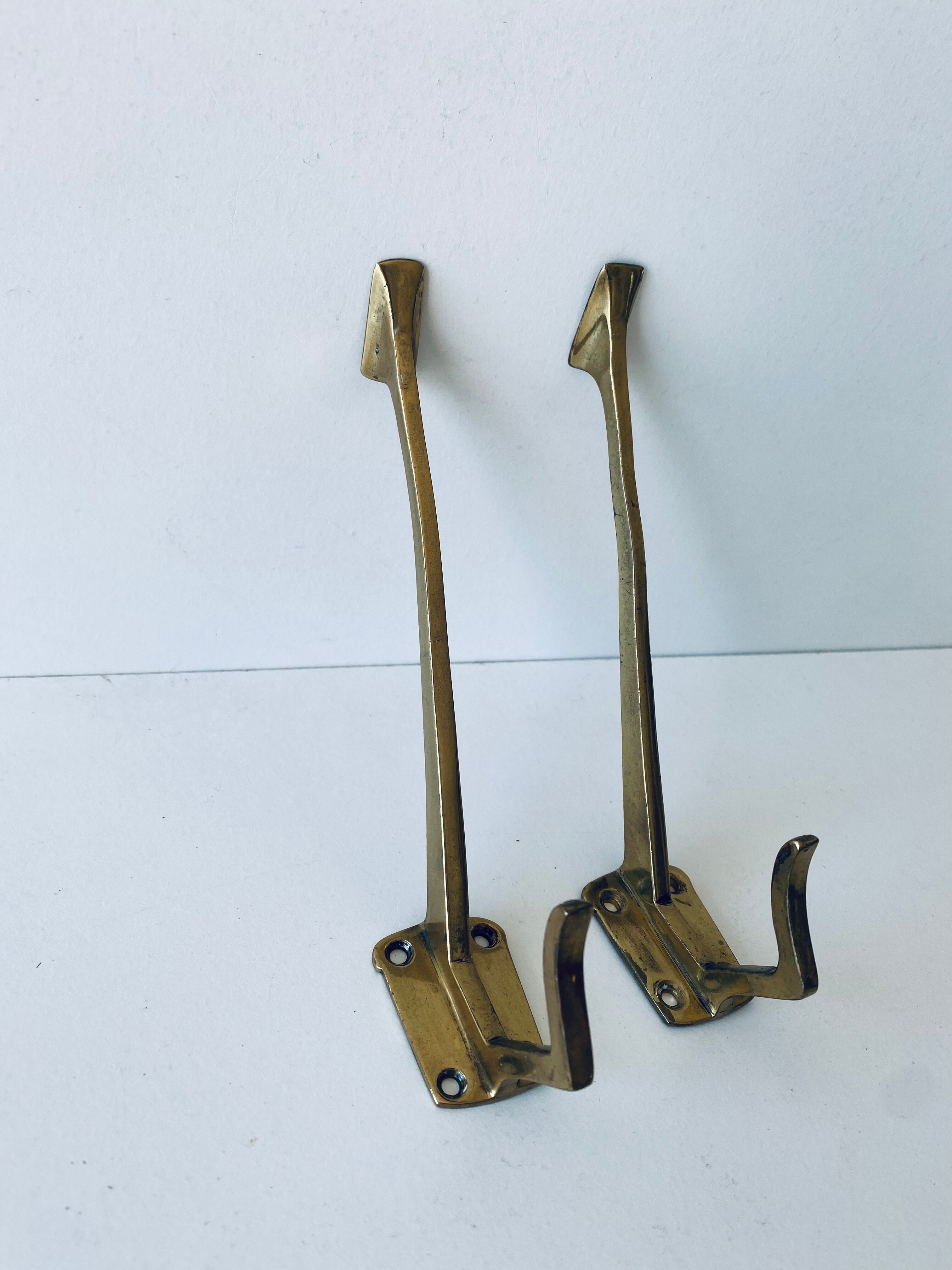 Pair of vintage brass hooks