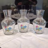 3 glass carafes, vintage. Very pretty floral pattern.