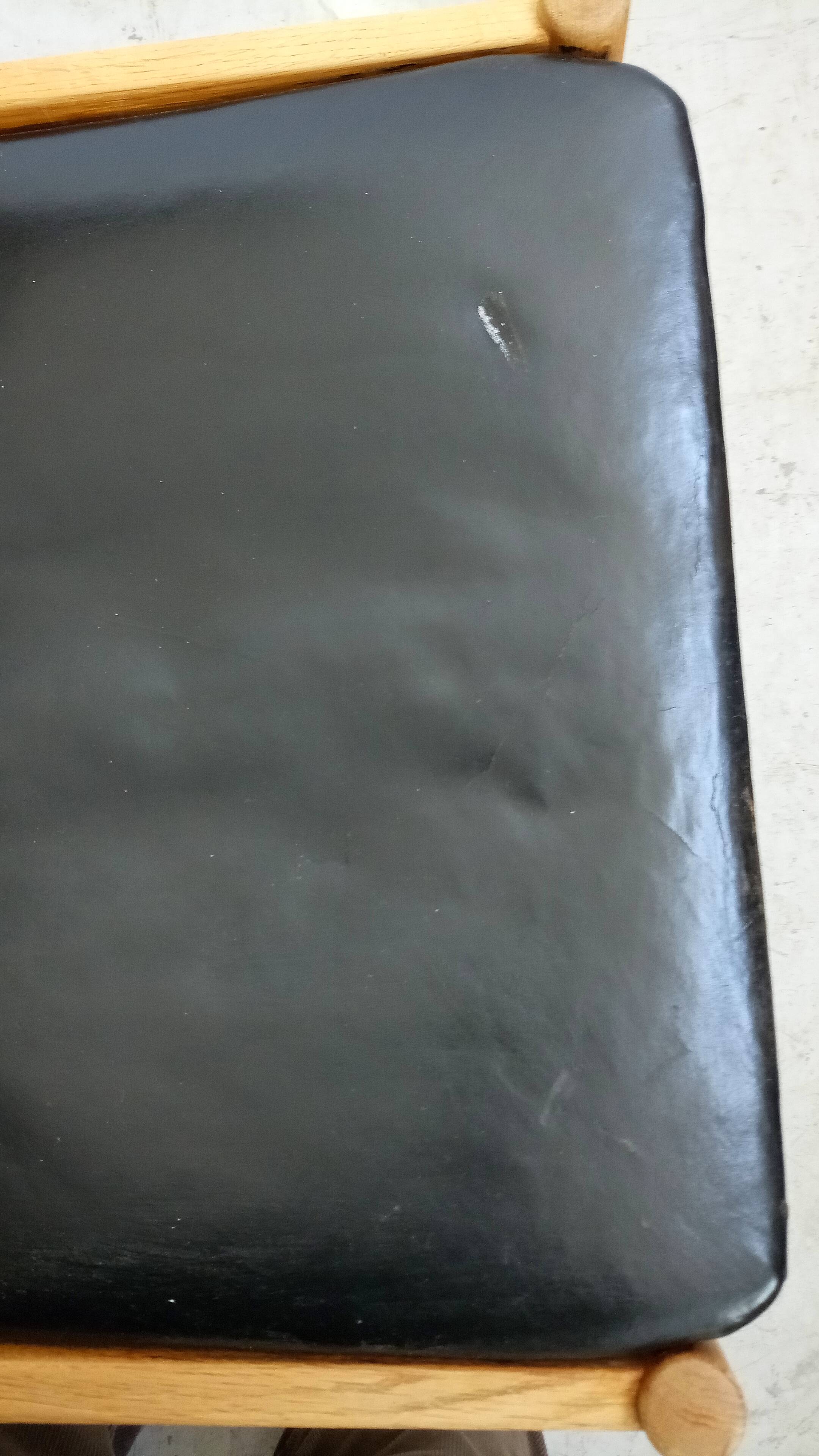 Danish armchair in oak and black leather