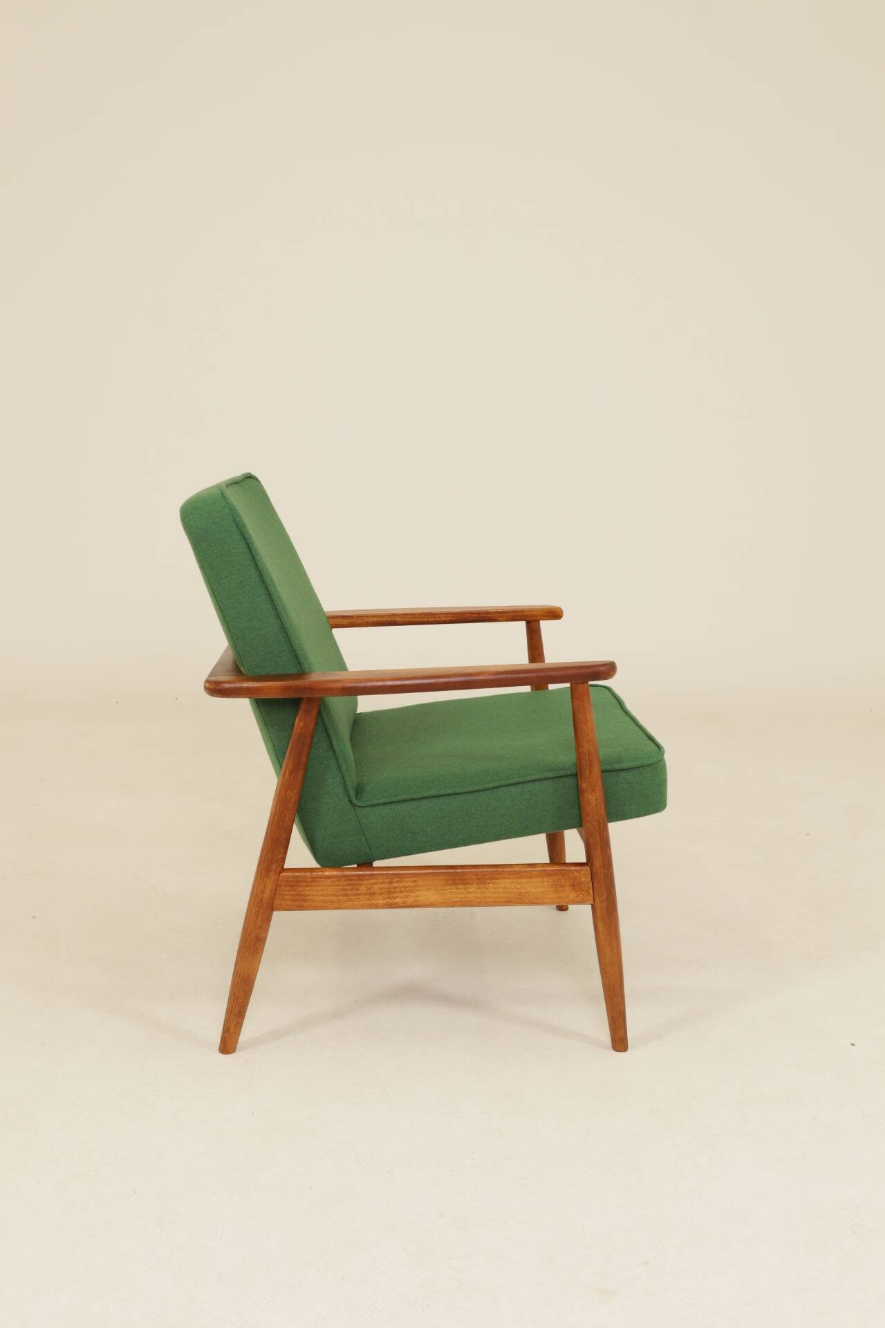 Scandinavian modern chair in green wool, vintage wooden armchair.