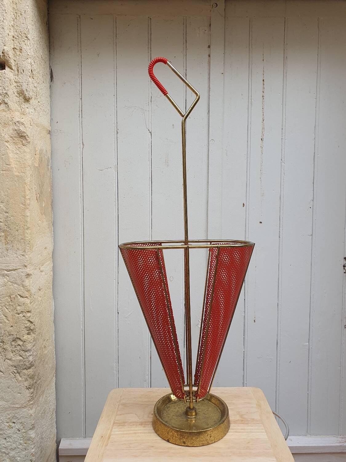 Perforated metal umbrella stand and scoubidou