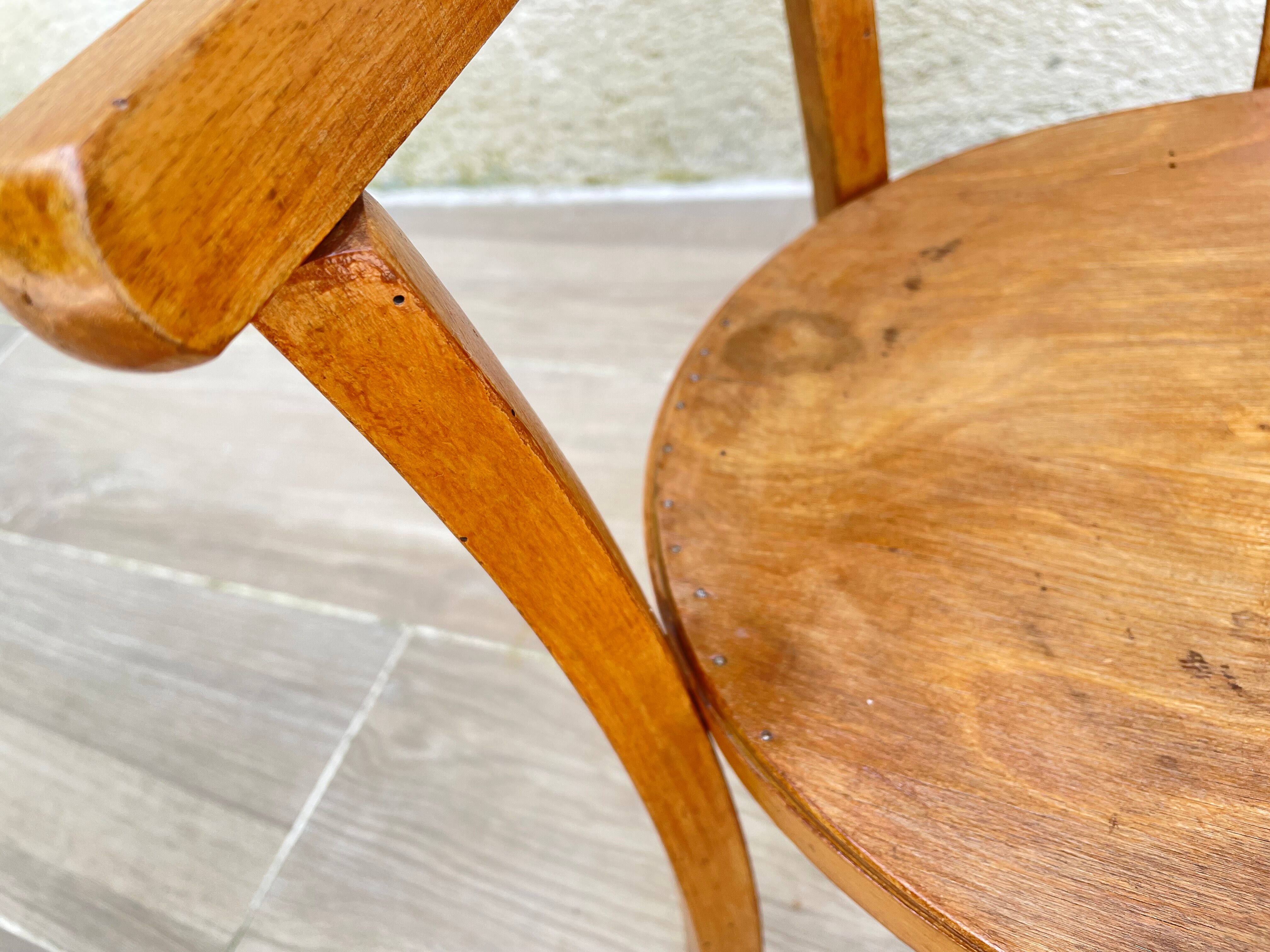 Old armchair for children in wood