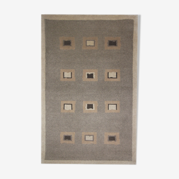 Handwoven matt cream wool carpet 61x91 cm