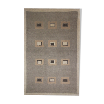Handwoven matt cream wool carpet 61x91 cm