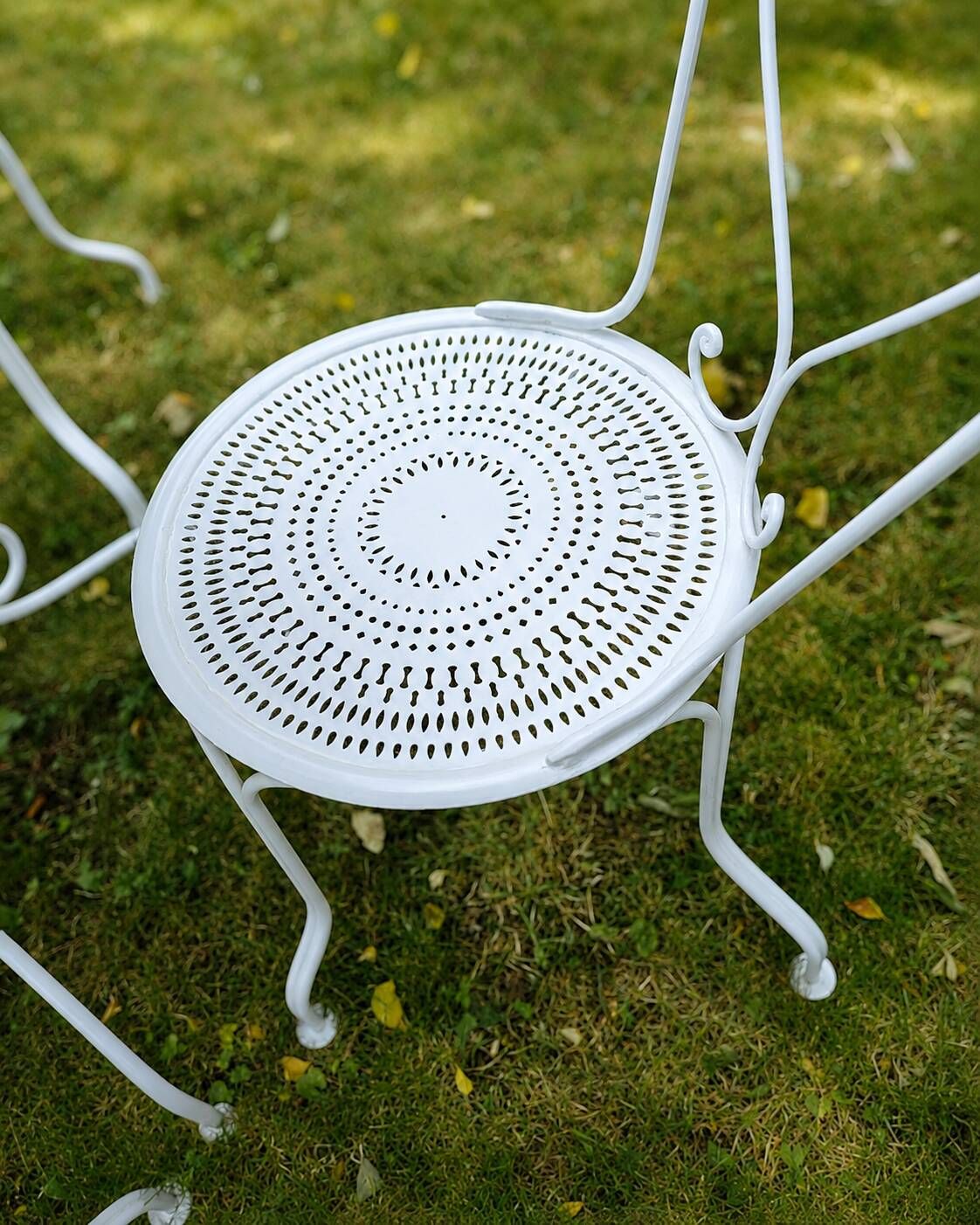 Renovated antique garden furniture in wrought iron, early 20th century.
