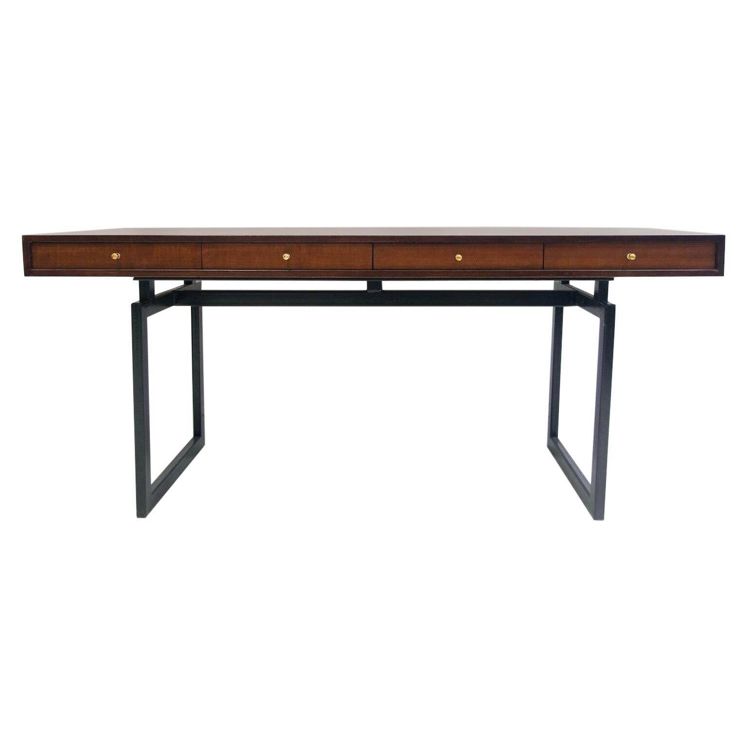 Wooden desk with drawers and black lacquered legs.